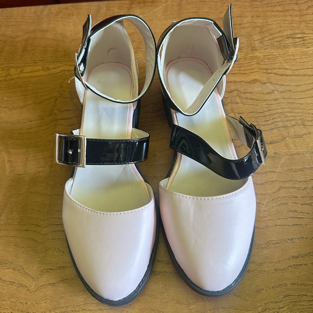 Pink shoes with black straps